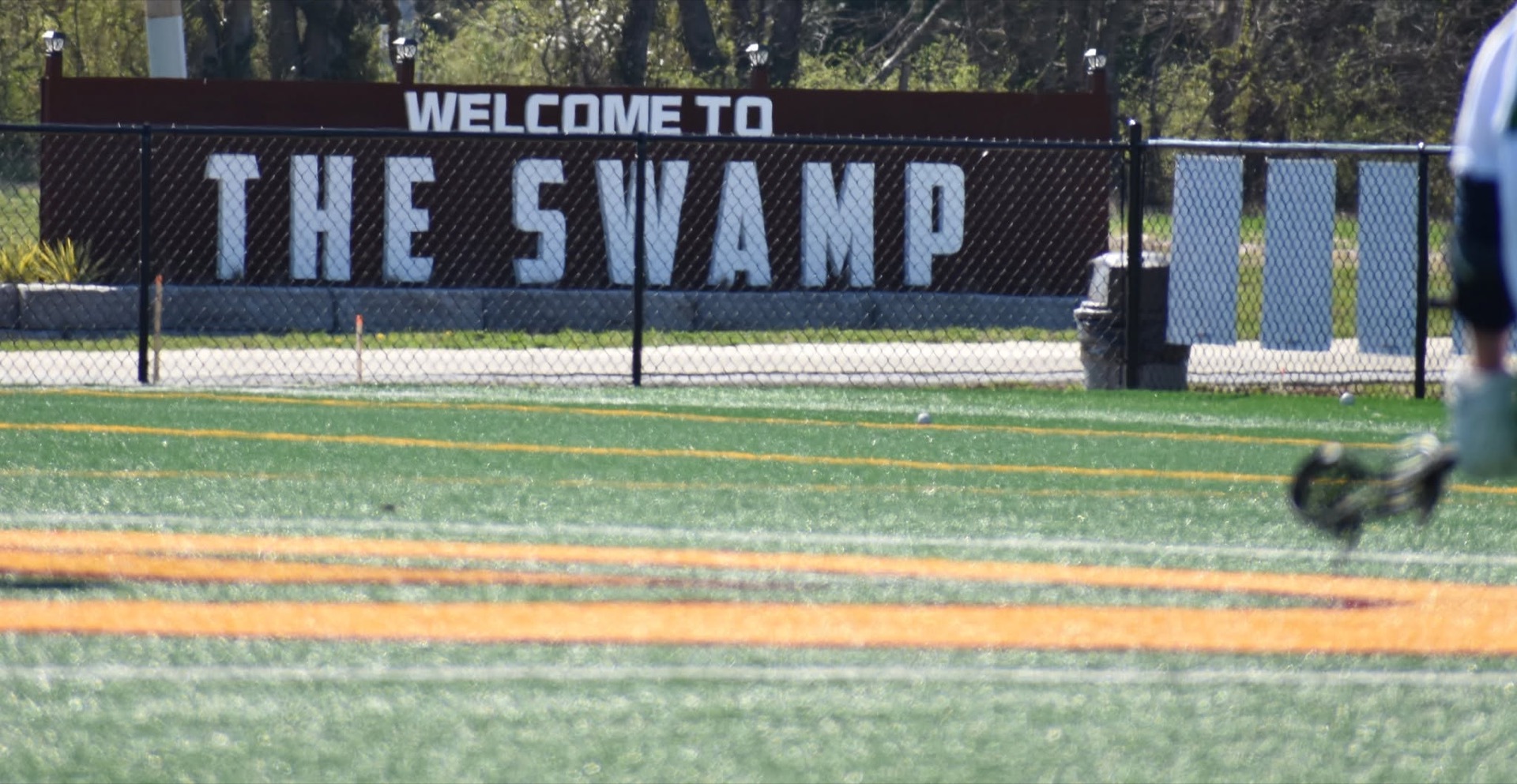Welcome to The Swamp sign at the Greenwood field